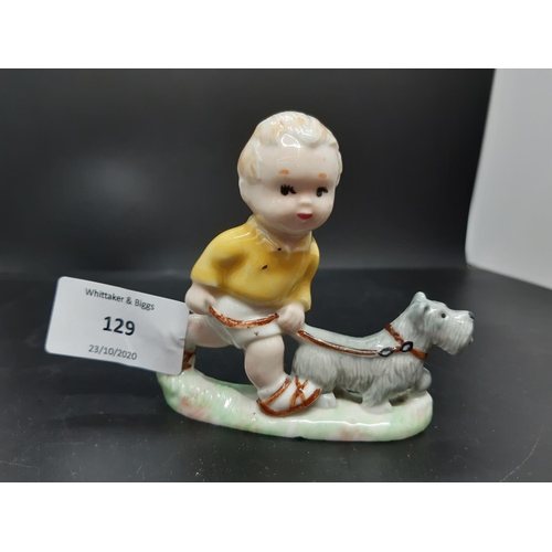 129 - A mid 20th century Wade Mabel Lucie Attwell porcelain figurine of Sam walking the dog - measuring ap... 