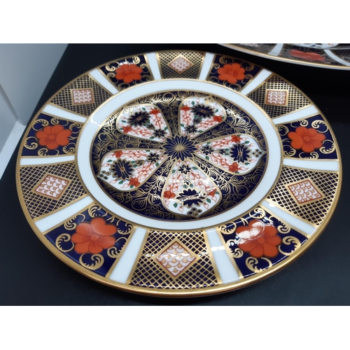 136 - Three Royal Crown Derby old imari 1128 plates to include dinner plate and two side plates - dinner p... 