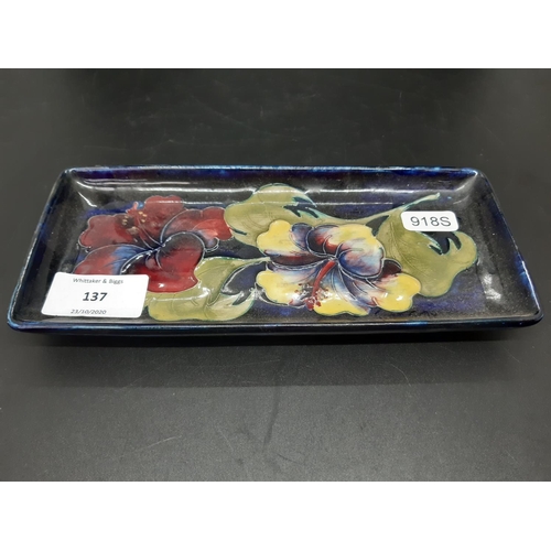 137 - A Moorcroft pottery rectangular dish in the anemone pattern - measuring approx. 20.5cm x 9cm