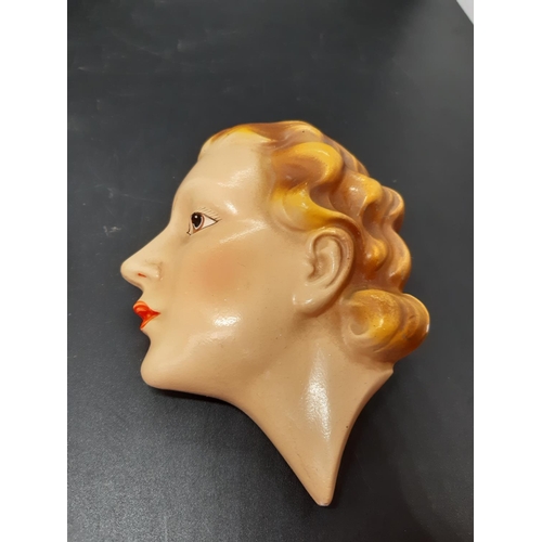 138 - A pair of Art Deco porcelain lady wall plaques - measuring approx 14cm. high (see condition report)