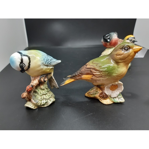 144 - Eight Beswick bird figurines to include Goldcrest no. 2415, Whitethroat no. 2106, Nuthatch no. 2413,... 