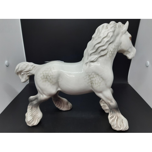 149 - A Beswick dapple grey shire horse figure - measuring approx 22cm high (see condition report)