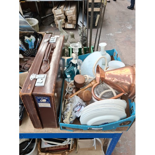 391 - A box and a brown leather suitcase containing mixed items to include Victorian copper jug, Royal Dou... 