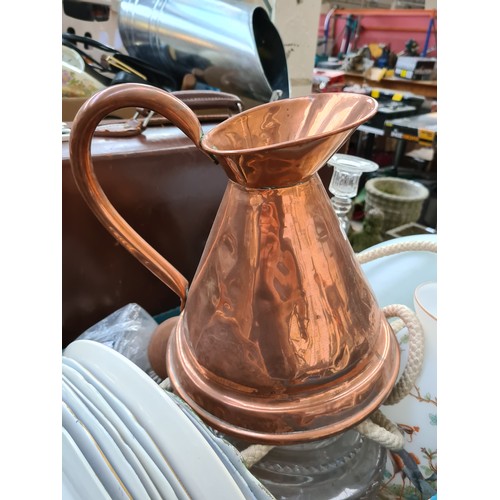 391 - A box and a brown leather suitcase containing mixed items to include Victorian copper jug, Royal Dou... 