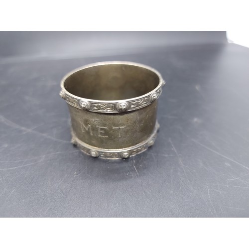 19A - Three napkin rings to include two hallmarked Birmingham silver napkin rings and a trench art napkin ... 