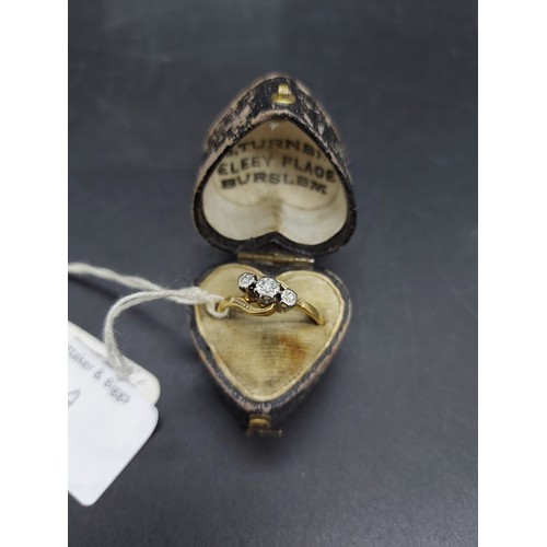 75A - A cased hallmarked 18ct gold ladies ring with three inset diamonds - size P and approx. total weight... 