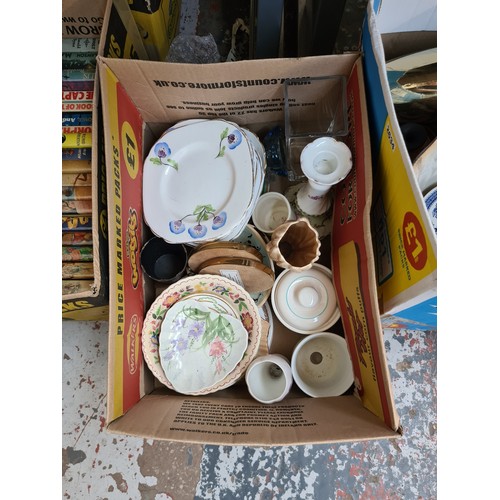 415 - Five boxes and a bag containing vintage books, CD cases, ceramics, mixed china and glassware etc