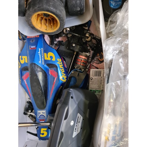 411 - A boxed Subaru Impreza remote control rally car and two boxes containing Commando magazines