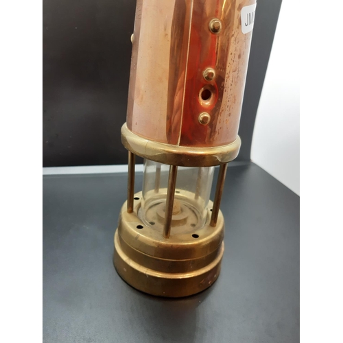 124 - A reproduction copper and brass coal mining lantern with British Coal Mining Company plaque