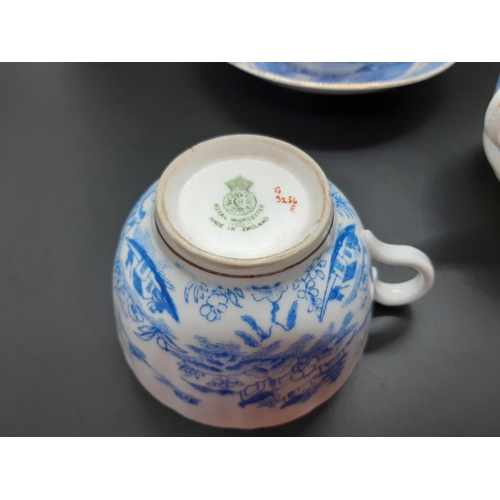 127 - Four pieces of antique blue and white china to include a Royal Worcester tea cup with oriental pagod... 