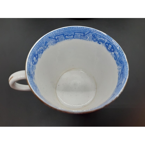 127 - Four pieces of antique blue and white china to include a Royal Worcester tea cup with oriental pagod... 