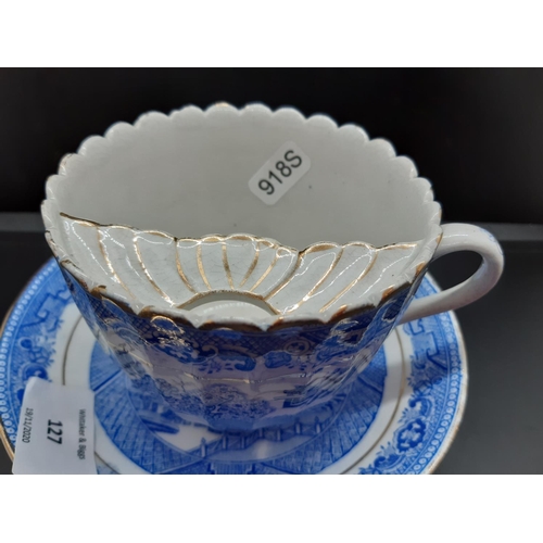 127 - Four pieces of antique blue and white china to include a Royal Worcester tea cup with oriental pagod... 