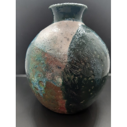 81 - A mid 20th century studio pottery vase with blue, green, white and brown earthy tones signed 'M' to ... 