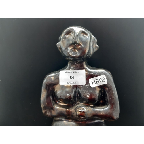 84 - A mid 20th century studio pottery sculpture of a seated nude women signed 'DK' to reverse - measurin... 