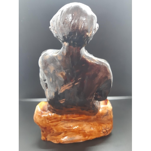 84 - A mid 20th century studio pottery sculpture of a seated nude women signed 'DK' to reverse - measurin... 