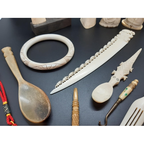 120 - A collection of vintage ivory and horn collectibles to include cutlery, figurines and bangle (see co... 