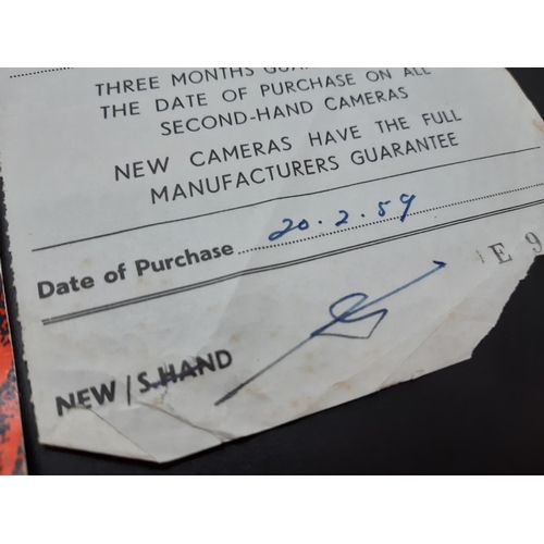 121 - A 1950s leather cased Swiss made Paillard Bolex B8 8mm cine camera with purchase receipt dated 20.2.... 