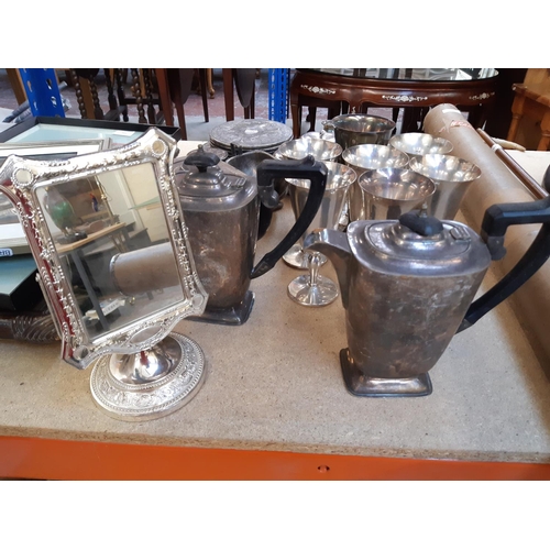157 - A collection of assorted metalware to include EPNS four piece tea and coffee set, silver plated plac... 