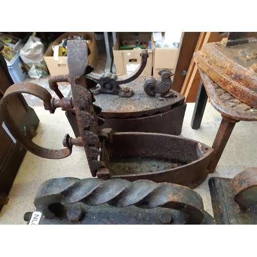 165C - Four 19th century charcoal flat irons and four various flat iron stands