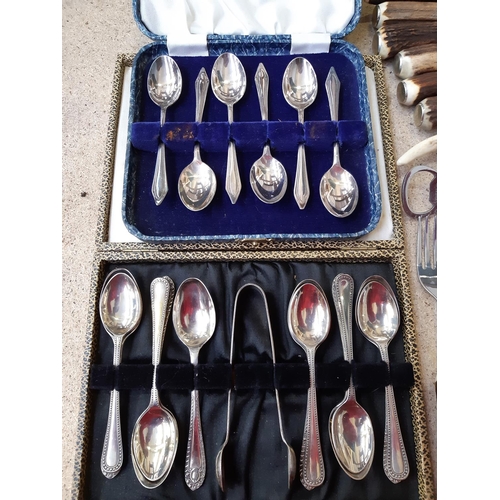 165E - A large collection of cased and loose vintage cutlery to include antler handled cutlery, teaspoons, ... 