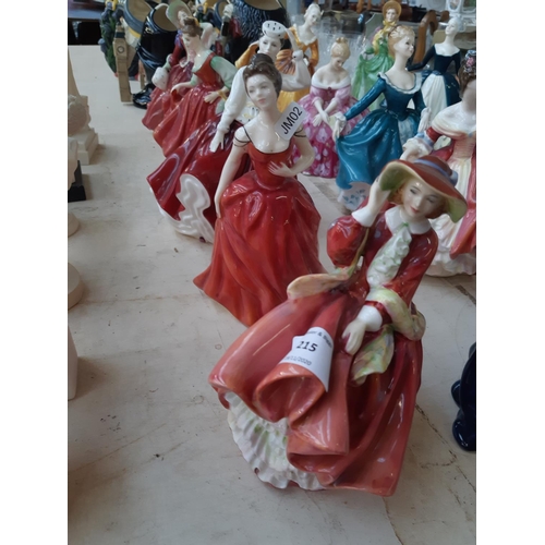 215 - Five Royal Doulton figurines to include 'Top O' The Hill', 'Innocence', 'Gail', 'Fair Lady (Red)' an... 