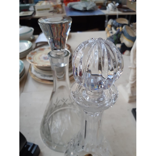 217 - Four pieces of glassware to include Waterford crystal decanter, Cranberry glass decanter with etched... 