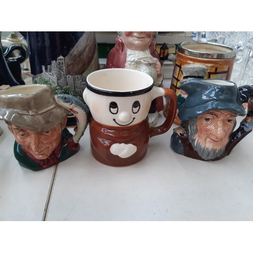 223 - Ten ceramic items to include Staffordshire Toby jugs, Royal Doulton Rip Van Winkle character jug (se... 