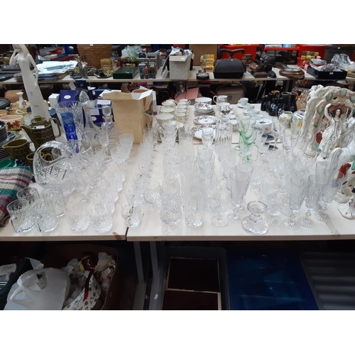 233 - A large collection of various glassware to include cut crystal decanter, champagne flutes, cut cryst... 