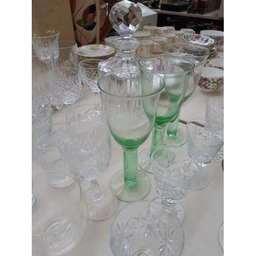 233 - A large collection of various glassware to include cut crystal decanter, champagne flutes, cut cryst... 