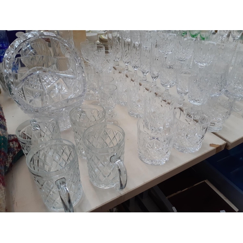 233 - A large collection of various glassware to include cut crystal decanter, champagne flutes, cut cryst... 