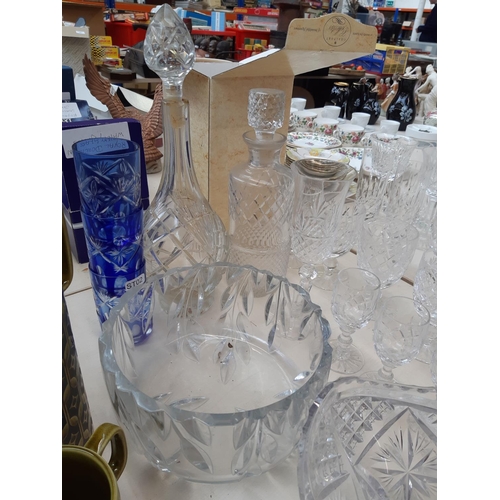 233 - A large collection of various glassware to include cut crystal decanter, champagne flutes, cut cryst... 