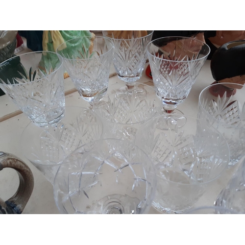 262 - A collection of mixed items to include a large quantity of cut glass and crystal drinking glasses, f... 