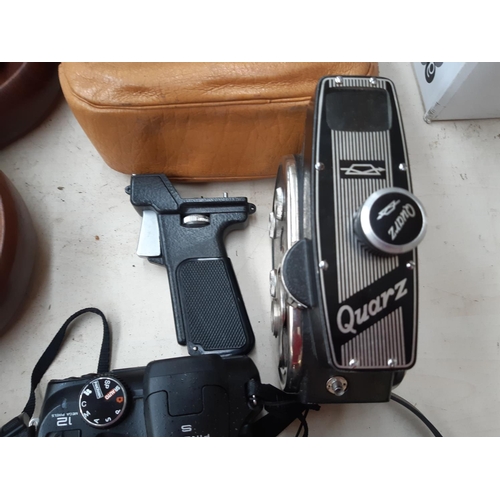 267 - Four items to include a black leather cased Cowley automatic level, Canon IXUS 960 IS 12.1 megapixel... 