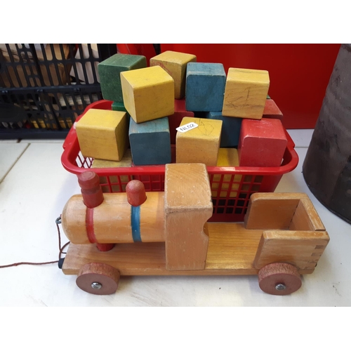 284 - A large quantity of children's toys to include wooden block and train sets, plastic farmyard animal ... 