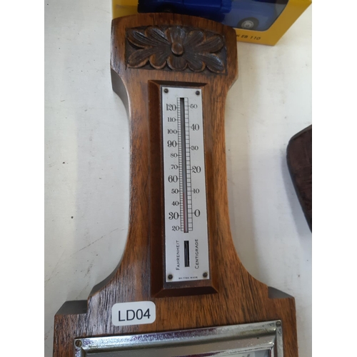 289 - A vintage oak barometer - measuring approx. 40.5cm high