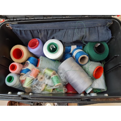 291 - A black plastic tool box containing sewing accessories and a vintage tin containing various keys