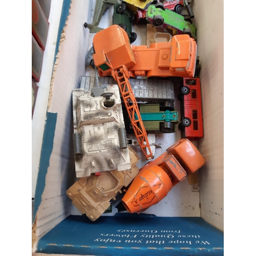 303 - A box containing various diecast vehicles to include Dinky, Corgi, Matchbox etc.