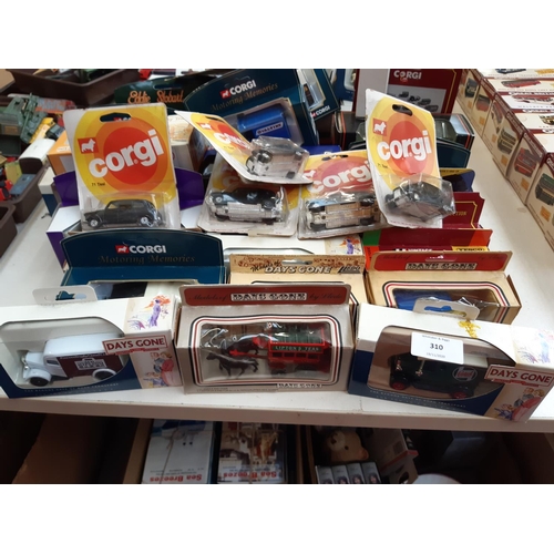 310 - A large collection of boxed diecast vehicles to include Corgi taxis, Lledo Days Gone model A Ford va... 