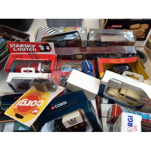 310 - A large collection of boxed diecast vehicles to include Corgi taxis, Lledo Days Gone model A Ford va... 