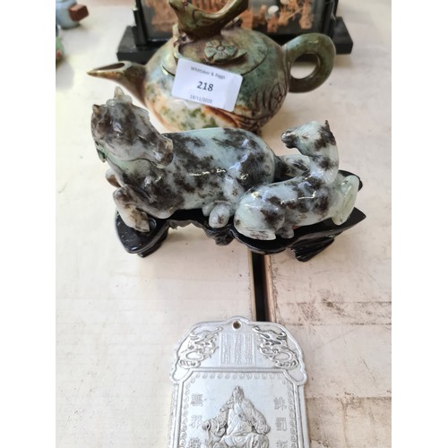 218 - Five oriental collectibles to include a carved jade effect horse and foal figurine on hardwood stand... 