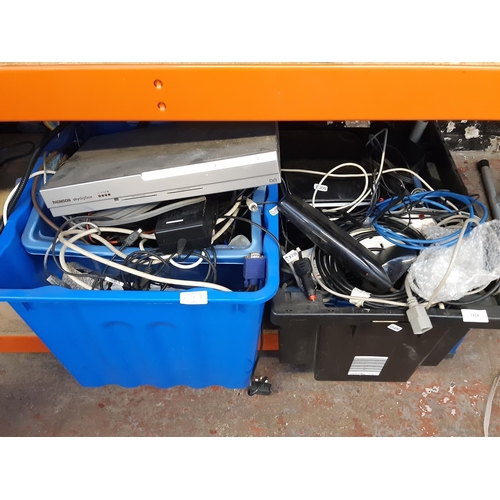 1319 - Two boxes containing a Thompson sky digibox, internet hubs, multi-plugs, various leads etc.
