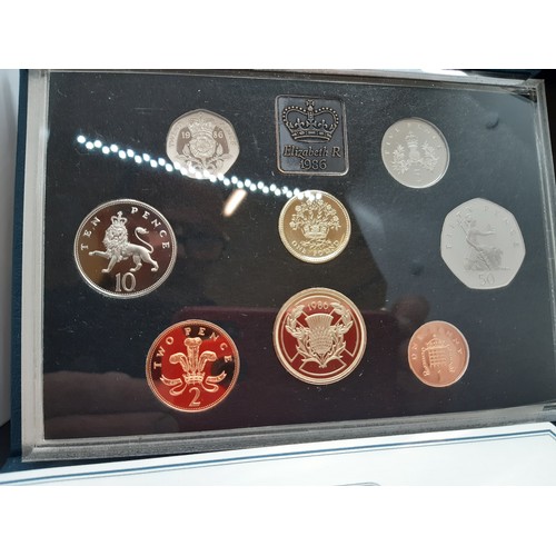 62A - Four British coin collector's sets to include 1985, 1986 and 1993 Royal Mint Proof Coin Collections,... 