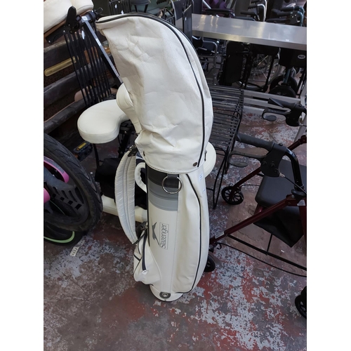 1021 - A white Slazenger golf bag containing Penfold golf clubs