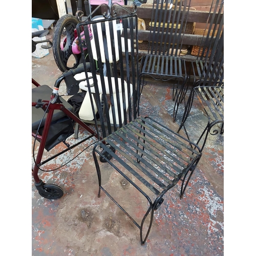 1024 - Four black painted metal garden chairs