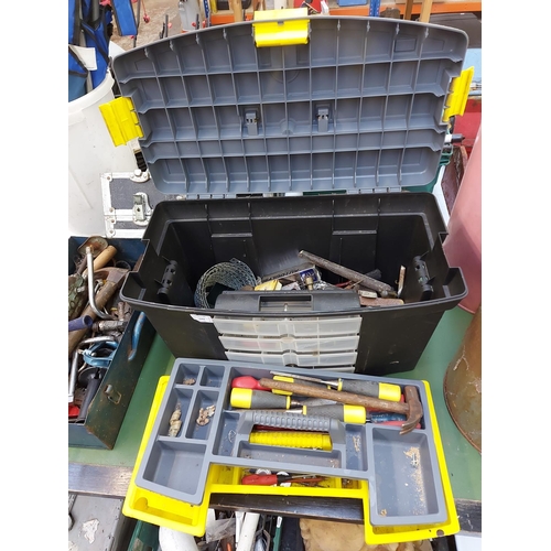 1242 - Two toolboxes, a black plastic and a blue metal, with contents to include heavy duty hand drill, woo... 