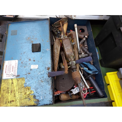 1242 - Two toolboxes, a black plastic and a blue metal, with contents to include heavy duty hand drill, woo... 