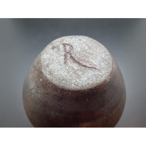 101 - A studio pottery ovoid vase with copper lustre exterior and signed 'R' to base - measuring approx. 1... 