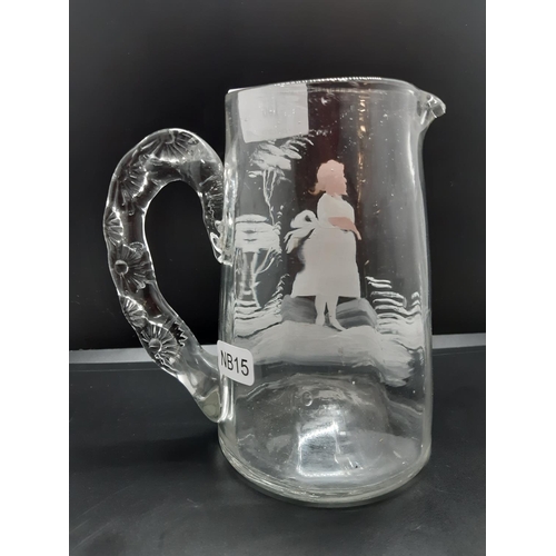 106 - A Victorian Mary Gregory style jug with hand painted design - measuring approx. 14cm