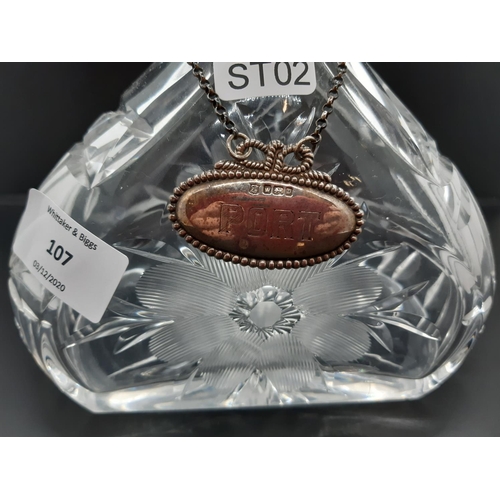 107 - A good quality cut crystal decanter with floral design, silver plated collar and hallmarked Sheffiel... 