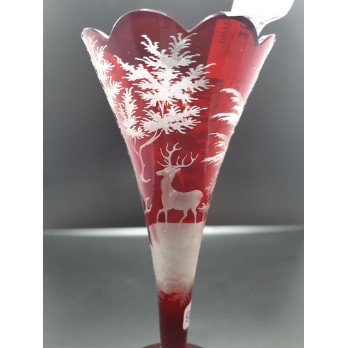 108 - A vintage Bohemian ruby glass trumpet vase - measuring approx. 17.5cm high (see condition report)